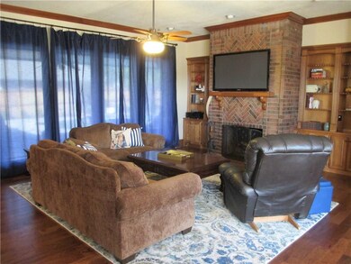 Large spacious living room. Gas log fireplace that
