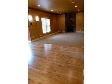 Living Room. Gas fireplace with stone surround.  w