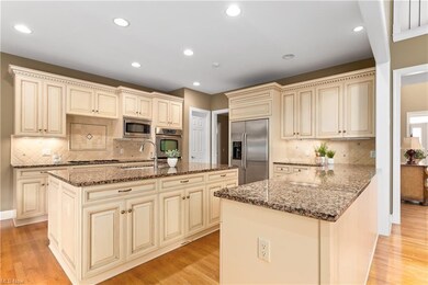 Glazed cabinetry and granite counter tops provide 