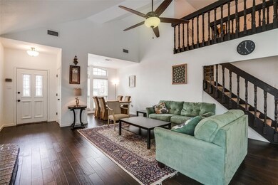 Spacious open-concept den with engineered wood flo