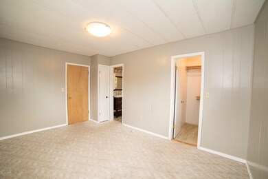 Master bedroom showing master bath entry