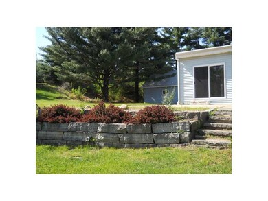 Exterior Back. Steps to the patio from yard, surro