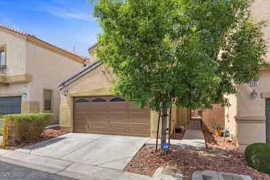 View of front of property with concrete driveway,