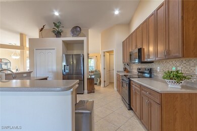 Kitchen featuring stainless steel fridge with ice