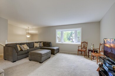 The living room is filled with natural light from 