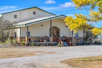 View of front of barn with office