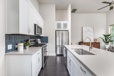 Kitchen featuring stainless steel appliances, a s