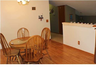 Wood Laminate Flooring in Kitchen w/ Entry to Wood