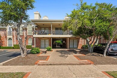 View of front of home with french doors, a balcon