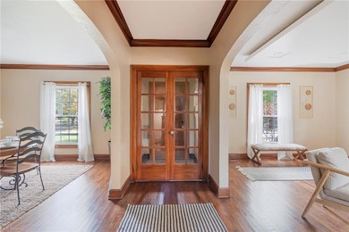 Entryway with ornamental molding, plenty of natura