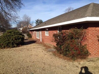 Back of home showing large patio, door immediately