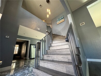 Staircase with a towering ceiling, marble finish f