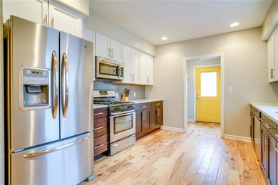 Additional view of the kitchen. The powder room is