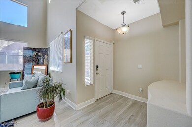 Foyer entrance featuring light wood finished floor