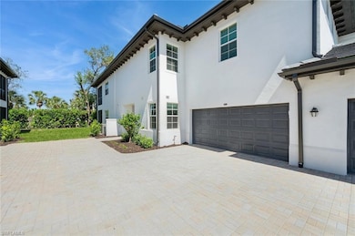 View of property exterior featuring decorative dri