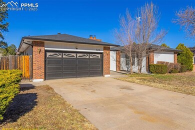 Ranch-style home with concrete driveway, an attach
