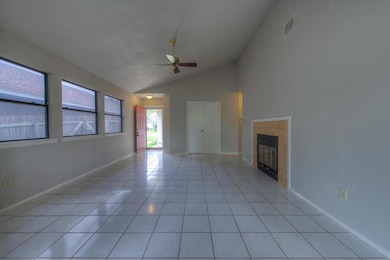 Unfurnished living room featuring ceiling fan, lo