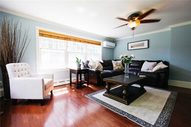 Sun-filled living room with gorgeous hardwood floo