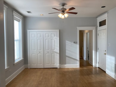 Drywall painted neutral grey with white trim, mapl