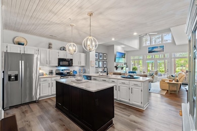 Kitchen with  stainless steel appliances, an islan