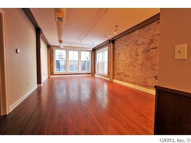Family Room. Beautiful exposed brick and beam...