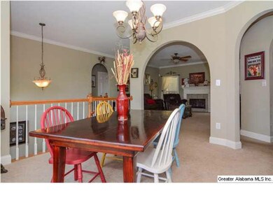 Formal dining room with arched entryways and a stu