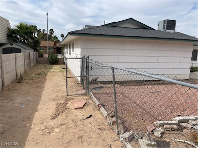 View of home's exterior with roof with shingles, f