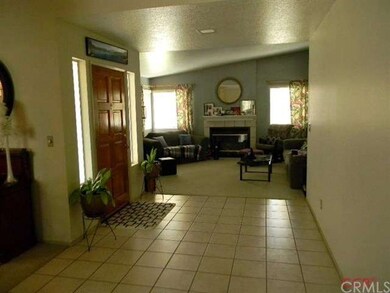 The home features a large entry and a formal livin