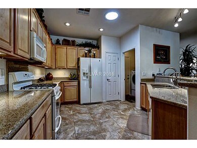 Kitchen. Spacious Granite-Adorned Kitchen Makes En