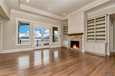 Main level living room with gas fireplace, open co
