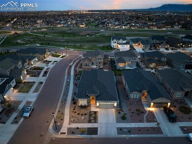 Aerial perspective of suburban area featuring a mountainous background