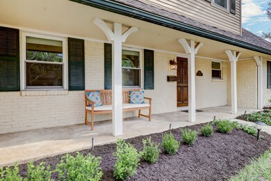 Guests are greeted by lush landscaping & inviting