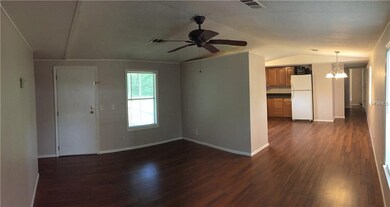 Panoramic view of living room, dining area and kit