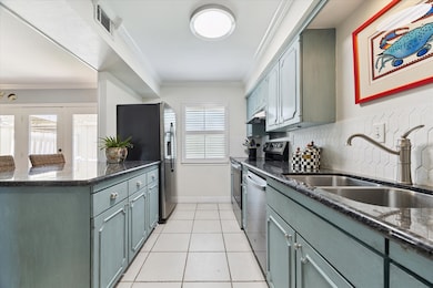 The kitchen has a roomy breakfast bar for gathering with friends and good storage along with a pantry.