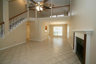 Family Room with fireplace opens to Formal Dining and Kitchen