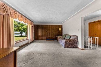 The living room is large and filled with natural l