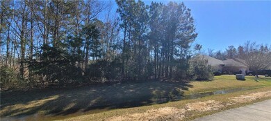 Deep 70 x 209 wooded lot