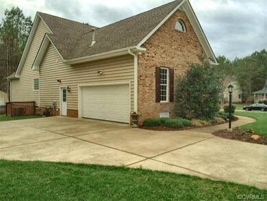 Home offers custom concrete Driveway to a side loa