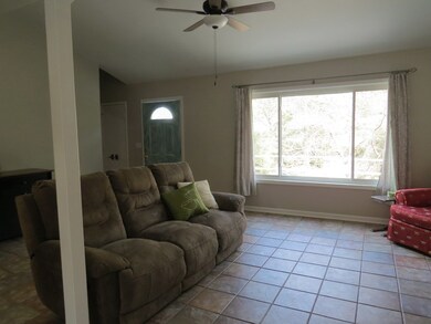 Family room with ceramic tile flooring
