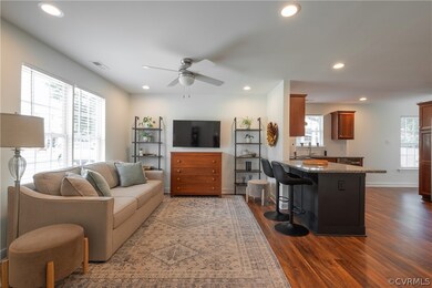 Living room with dark hardwood / wood-style floors