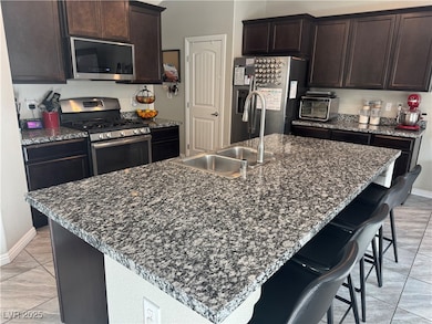 Kitchen with appliances with stainless steel finis