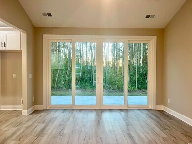 Doorway to outside with light hardwood / wood-styl