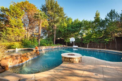 Pool, spa and lush landscaping