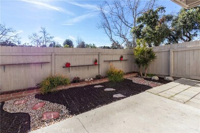 Large backyard with patio and rock garden.