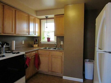 Kitchen. Newer cabinets, sink, ceramic tile floor,