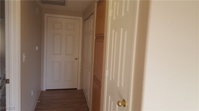 Hallway featuring wood finished floors