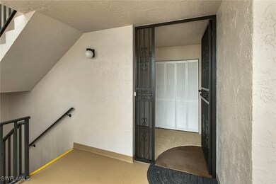 Stairs featuring a textured ceiling and a textured