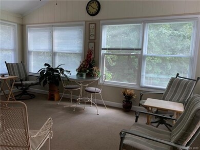 Sunroom accessed off living room, seen from kitche