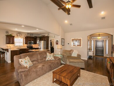 Living space opens to kitchen and dining room.