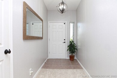 Welcoming entry with coat closet, tile flooring an